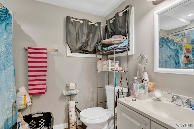 bathroom featuring vanity and toilet