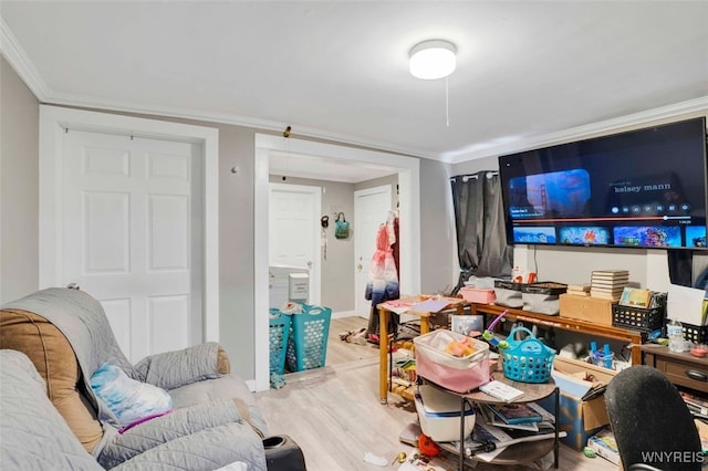 living room with light hardwood / wood-style floors and ornamental molding