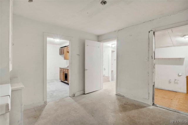 unfurnished bedroom featuring connected bathroom