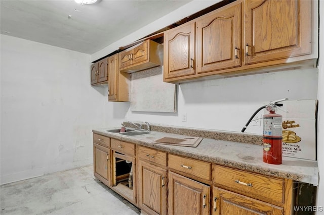 kitchen featuring light stone countertops and sink