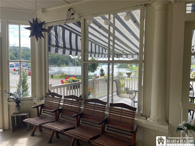 sunroom with a water view