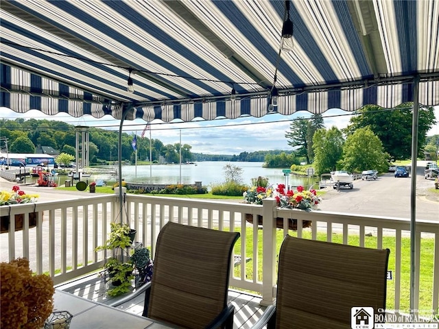 balcony featuring a water view