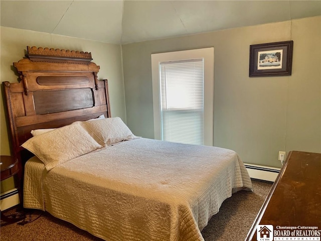 bedroom featuring dark colored carpet and a baseboard heating unit