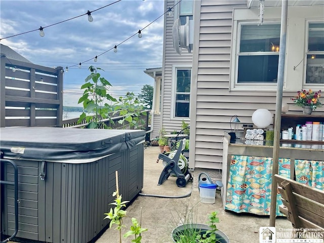 view of property exterior with a hot tub