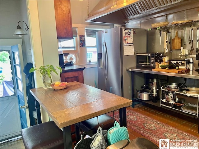 kitchen featuring dark tile patterned floors