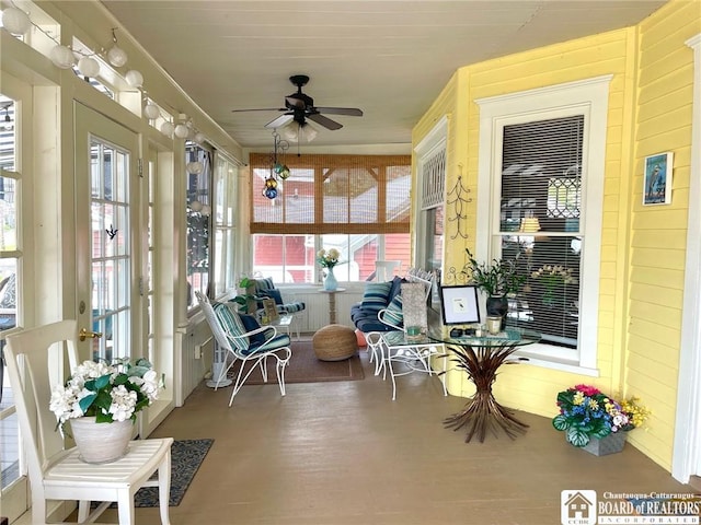 sunroom / solarium with ceiling fan