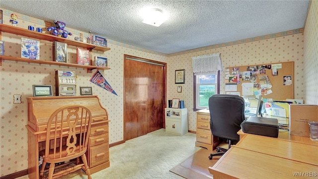 carpeted office featuring a textured ceiling