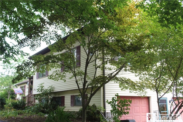 view of home's exterior featuring a garage