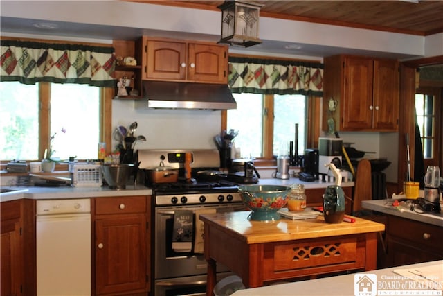 kitchen with butcher block countertops, gas range, and wood ceiling