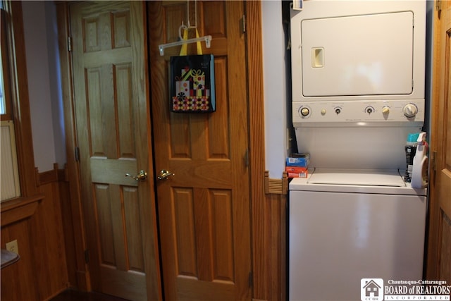 washroom featuring stacked washer and dryer