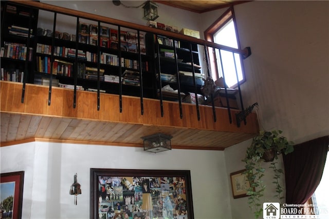 interior space with wooden ceiling and crown molding