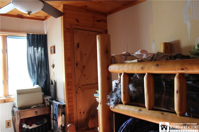 bedroom with wood ceiling and ceiling fan