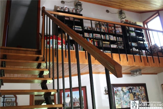 stairway featuring wood ceiling