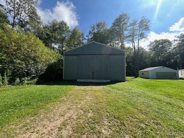 view of outbuilding with a lawn