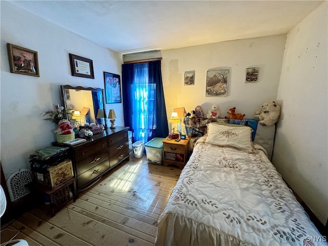 bedroom with hardwood / wood-style flooring