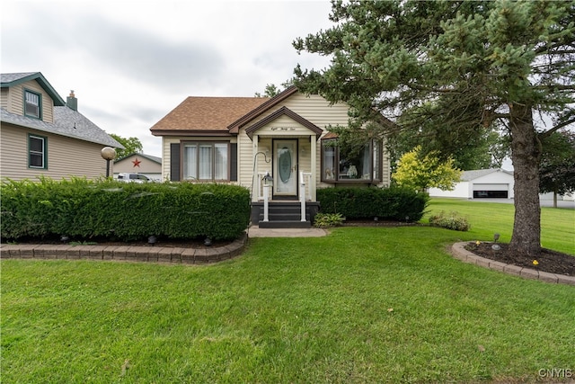 bungalow-style home featuring a front yard