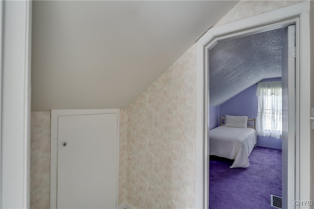 bonus room featuring lofted ceiling and carpet flooring