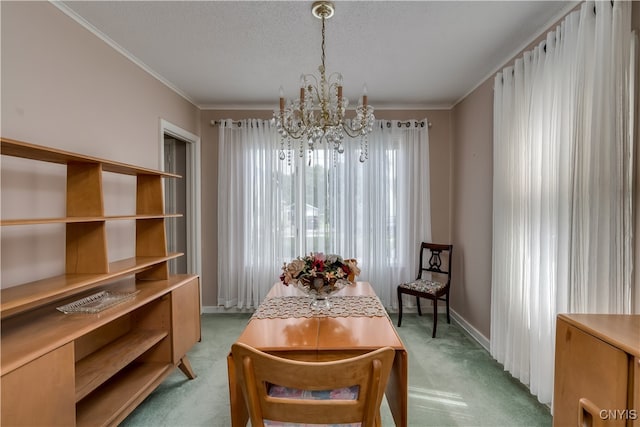 living area with light colored carpet, an inviting chandelier, a textured ceiling, and ornamental molding