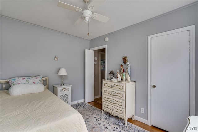 bedroom with ceiling fan and light wood-type flooring