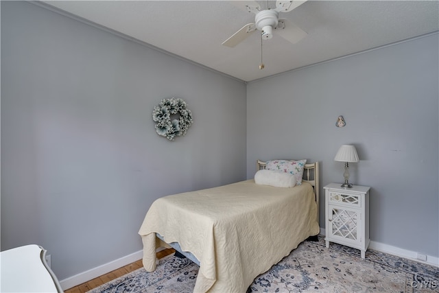 bedroom featuring ceiling fan and light hardwood / wood-style floors