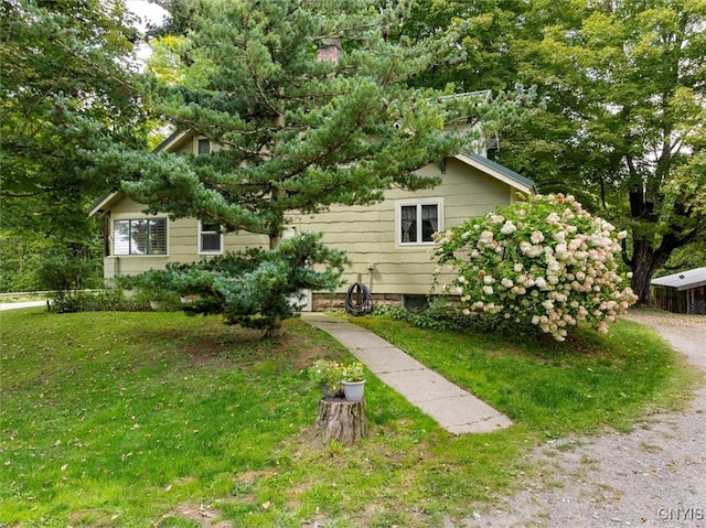 split level home featuring a front lawn