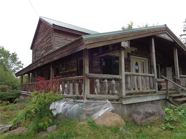 view of home's exterior with covered porch