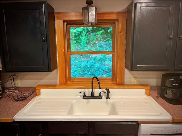 interior space featuring dishwasher and sink