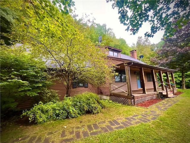 view of side of property featuring a porch