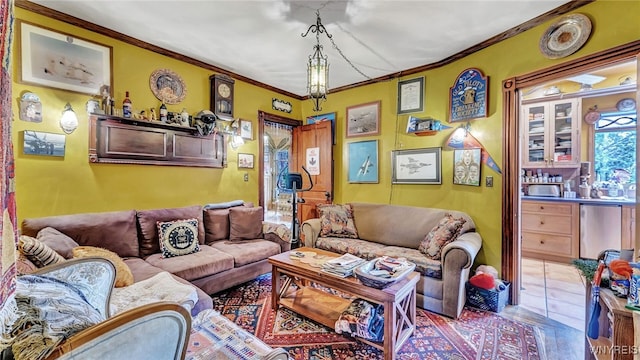 living room featuring bar and ornamental molding