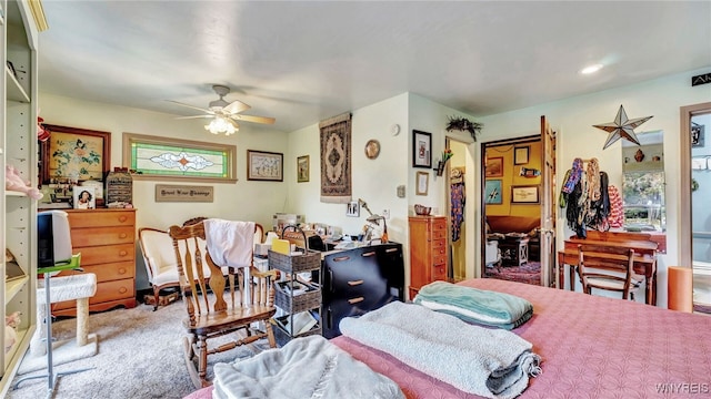 carpeted bedroom with ceiling fan