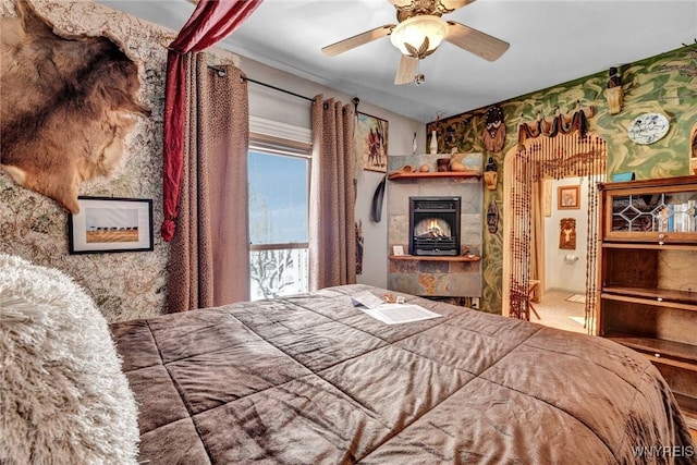 bedroom with ceiling fan and carpet flooring