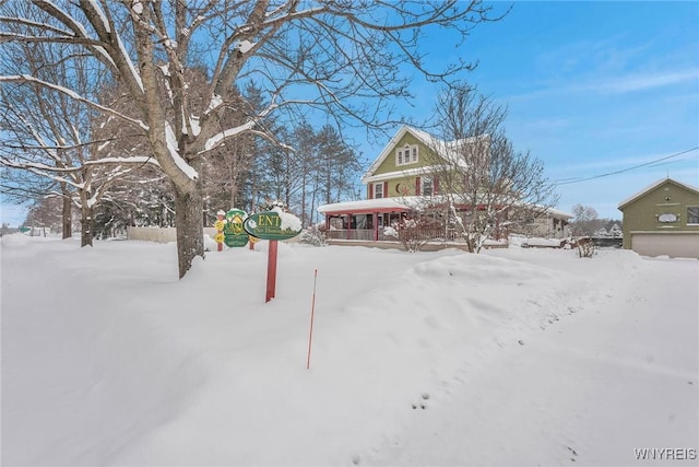 view of yard covered in snow