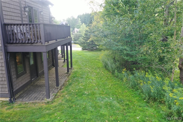 view of yard featuring a wooden deck