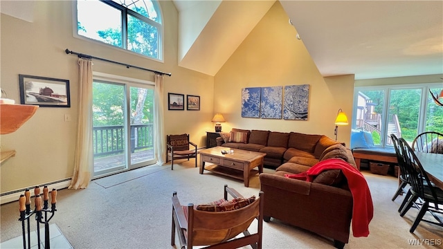 carpeted living room with a towering ceiling and a baseboard heating unit