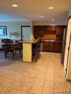 kitchen with a breakfast bar and sink