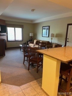 dining space with light colored carpet