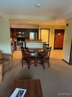 view of carpeted dining area