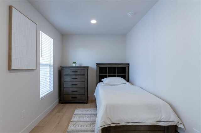 bedroom with light hardwood / wood-style flooring