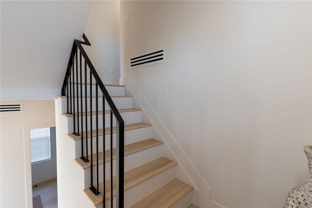 stairway with wood-type flooring