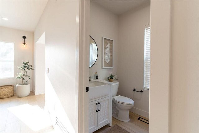 bathroom with toilet and vanity