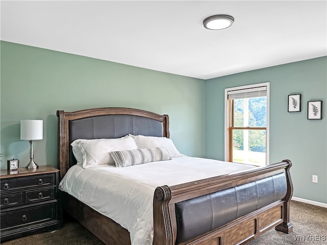 bedroom with dark carpet