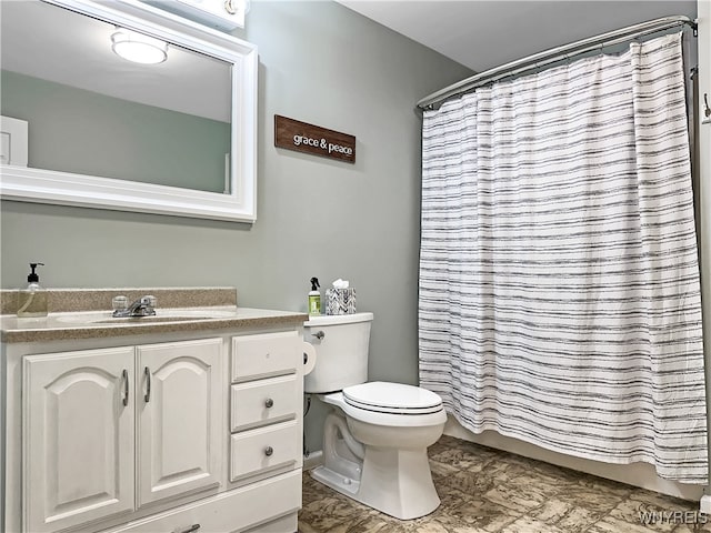 bathroom with vanity, toilet, and a shower with curtain