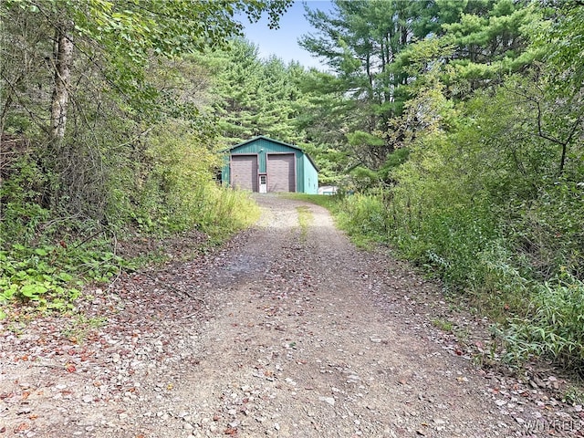 exterior space with a garage and an outdoor structure