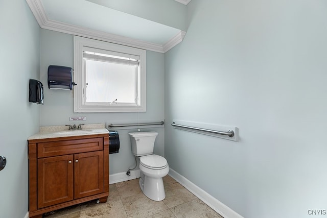 bathroom featuring crown molding, vanity, toilet, and tile patterned floors