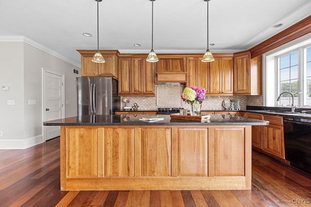 kitchen featuring a center island, stainless steel fridge, dishwasher, and dark wood-type flooring