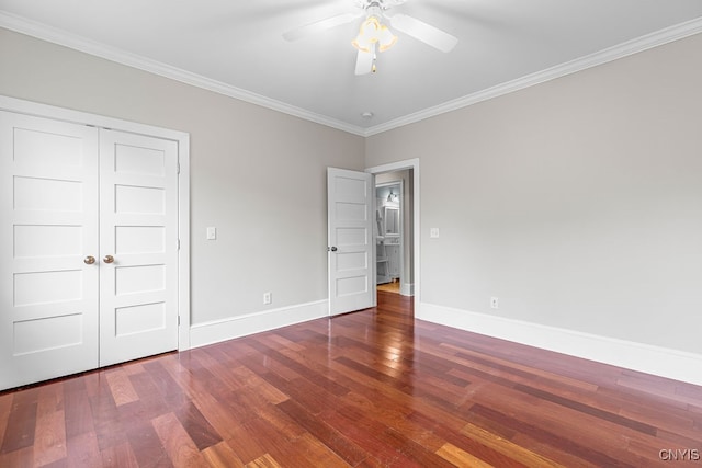 unfurnished bedroom with crown molding, hardwood / wood-style flooring, ceiling fan, and a closet