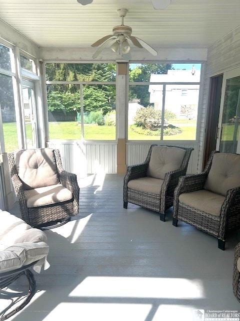 sunroom featuring plenty of natural light and ceiling fan