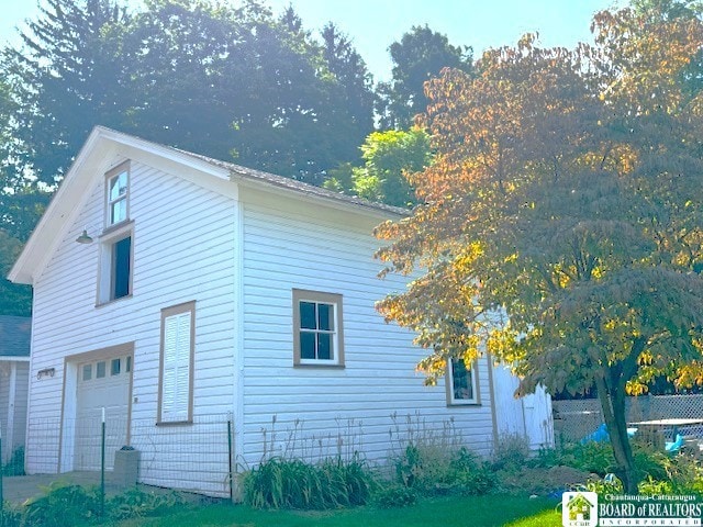 view of side of property with a garage