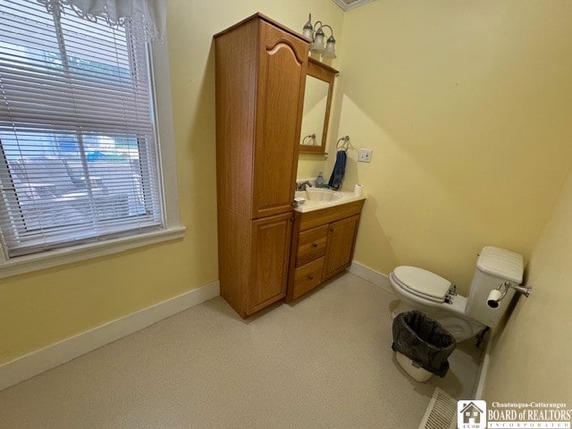 bathroom with toilet and vanity