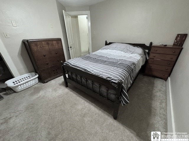 bedroom featuring light carpet